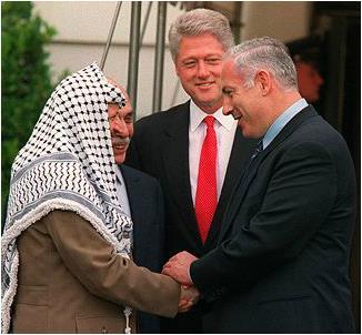 as Yasser Arafat, left, and Israeli Prime Minister