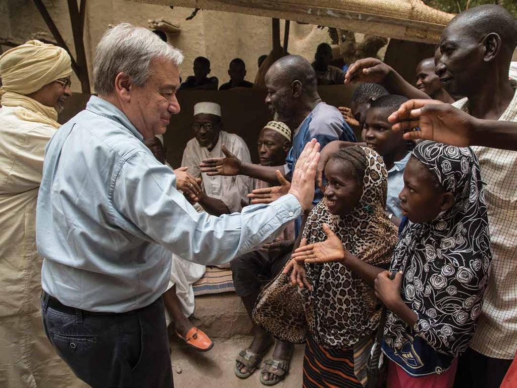 UN Secretary-General António Guterres greeting residents of Mopti, Mali after his visit to the Grand Mosque.