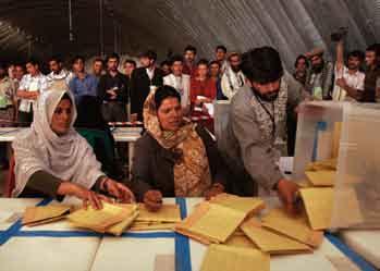 Photo: AP (Tomas Munita) Afghan election workers count ballot papers in Kabul after Afghanistan s landmark parliamentary elections on September 18, 2005.