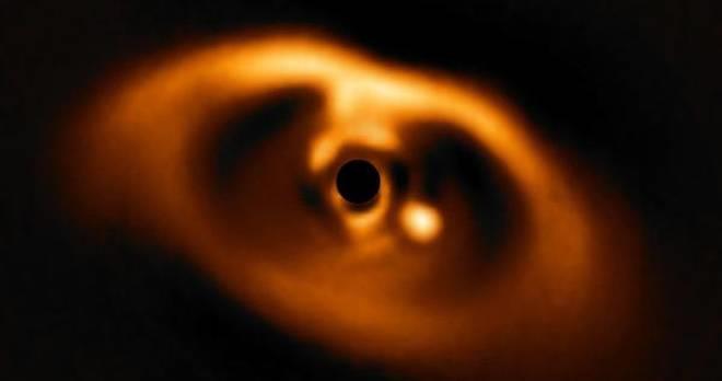 3. Astronomers capture image of a planet s birth Astronomers say they ve captured the first confirmed image of a planet forming in the dust swirling around a young star.