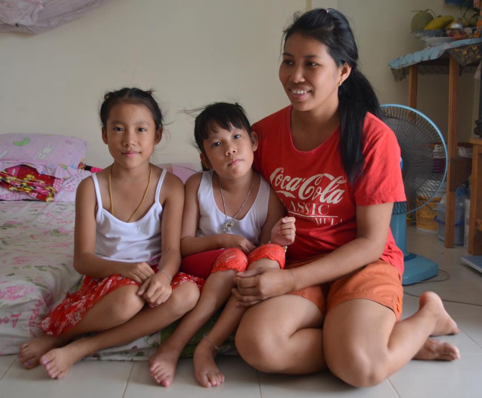 POY, PON (9 YEAR OLD TWINS) AND PIM (MOTHER) Pon (middle) has fluid on the brain and nerve problems.