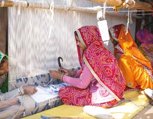 Women engaged in crafting Carpets in a Rajasthan Village their learning curve and gradually learned spinning and weaving up to international standards.