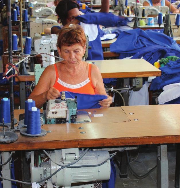 10 COOPERATIVE CREATION A Cooptex member owner sews fabric Financing remains a persistent challenge, but they have collectively contributed to business upgrades.