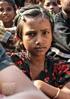 A young girl from a group of families affected by intercommunal