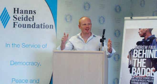 Andrew Faull, a researcher in the Crime and Justice Programme, speaks at a seminar to launch his book Behind the Badge: The untold stories of South Africa s Police Service members on 13 May 2010.