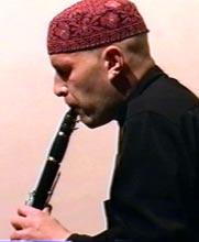The striking influence of Argentinean esthetics is a hallmark of the Crakow Klezmer Band s sophisticated arrangements. Old Oleg Dyyak, playing his clarinet.