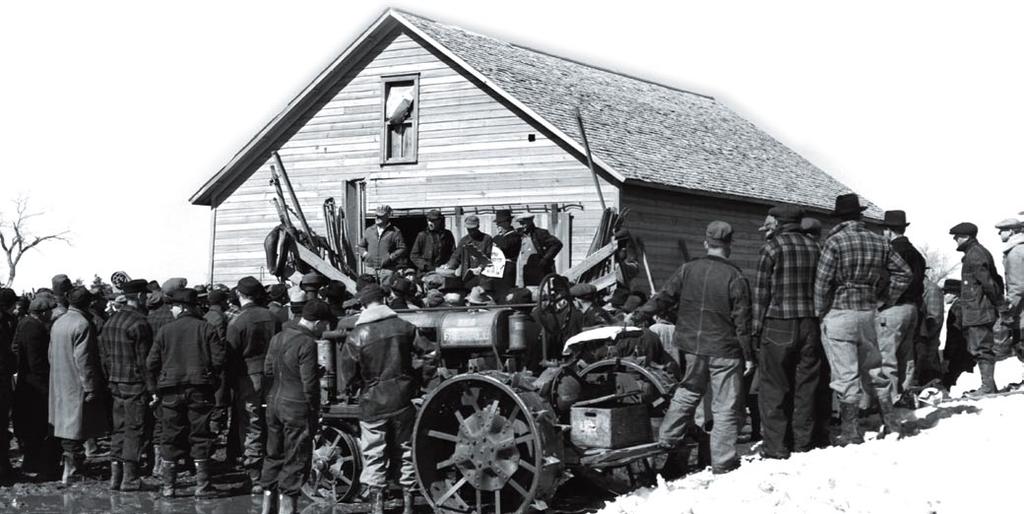 Farm equipment is auctioned off in Hastings, Nebraska. foreclosed and seized the property as payment for the debt. As farmers began to default on their loans, many rural banks began to fail.
