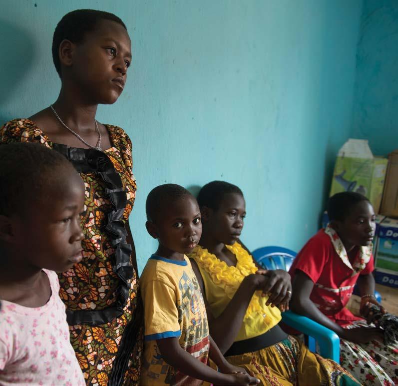 After fleeing South Sudan without their parents, Victoria, 16, waits with her brothers and sisters to be registered as refugees in Dungu Town in the Democratic Republic of the Congo.