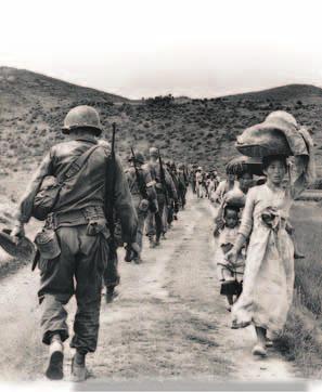 History American troops move forward to the battlefield, while South Korean women and children flee from the Communists. What was the state of the Korean conflict by January 1951?