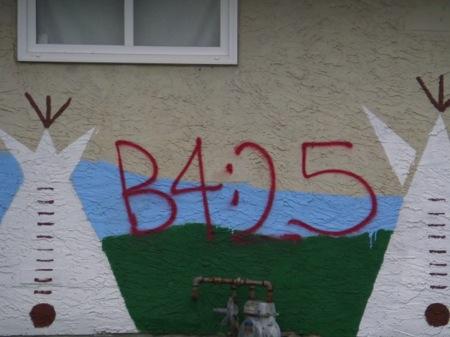Photograph 28. Graffiti over traditional First Nations art in Hobbema.