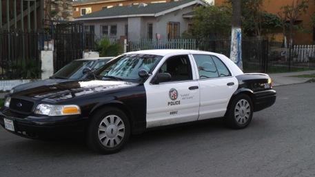 Photograph 30. LAPD gang squad patrol car. Photograph 31. Doors of car with ballistic panel.