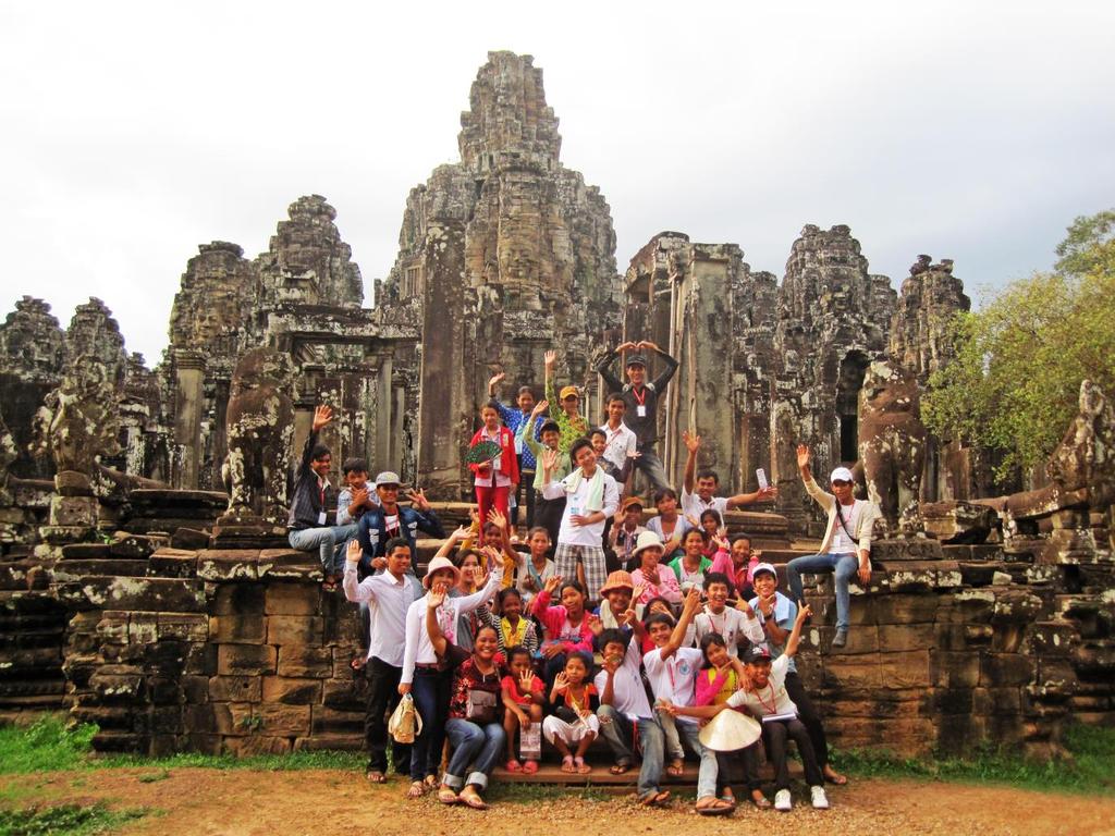 Students and teachers at Angkor Thom Arriving in Siem Reap after a 3 hour bus ride (a new highway has cut travel time to less than half), the group first visited Baray, a 17 km2 lake built in the
