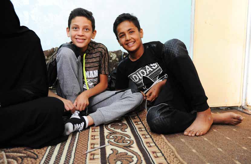 Ahmad with his cousin, Omer, both 13. Each boy tried working, but found it difficult and would rather be enrolled in school.