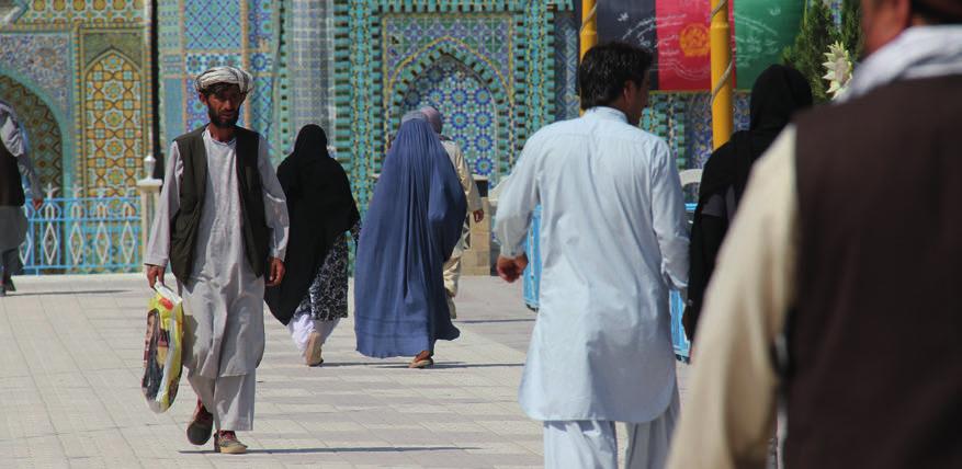 People in front of the mosque in Mazar-i-Sharif, Afghanistan. Mazar-i-Sharif, located in Balkh province in Northern Afghanistan, is considered a relatively calm city.