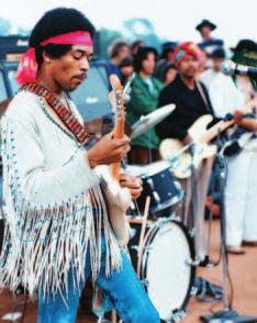 Jimi Hendrix performing at Woodstock society.