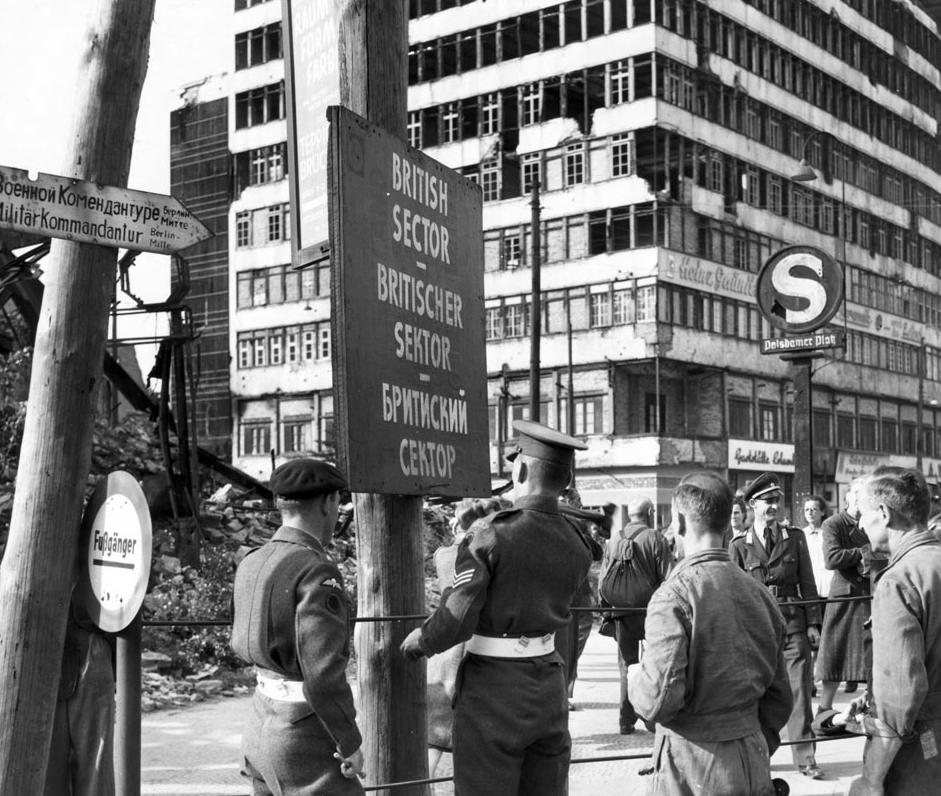 P L A C A R D D The Cold War Begins In this 1948 photograph, British military police put up a sign to mark the boundary between the