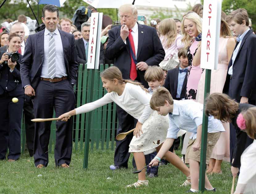AMERICAS 13 Trump to North Korean leader: Got to behave President Trump and his son Donald Trump Jr watch children roll Easter Eggs at 139th annual White House Easter Egg Roll on the South Lawn of