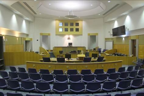 court room court room n. A court room is a room inside a court building where the judge sits to decide a court case.