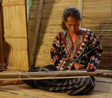 Treasure Awardee, teaches the young Tboli women the art of Tnalak weaving.