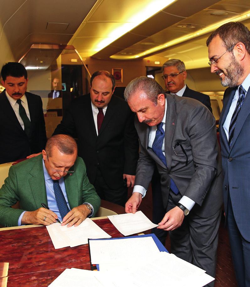 President Erdoğan signing the