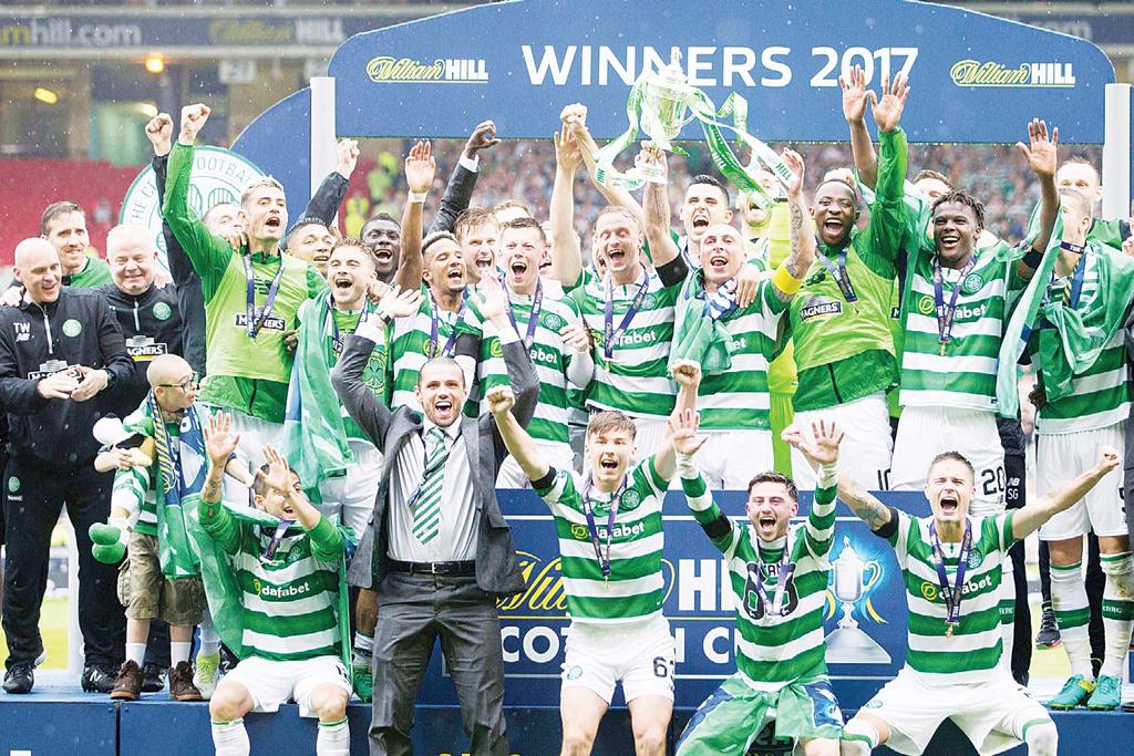 SPORTS 43 Celtic clinch perfect treble Rogic breaks Aberdeen hearts GLASGOW, May 27, (AFP): A stoppage time strike from Australian international Tom Rogic saw Celtic come from behind to defeat