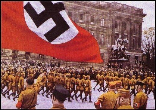 In Germany Hitler began violating the Treaty of Versailles building