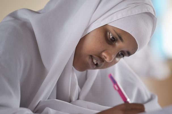 A girl takes an exam in the Waberi Secondary School in the Hagadera refugee camp, part of the Dadaab refugee