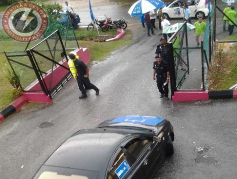 Voters used umbrellas with the party logo into the polling