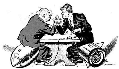 Cuban Missile Crisis 1. Who are the two men depicted in this cartoon and what are their basic political beliefs? 2. In what activity are the men participating? 3. On what objects are the men sitting?