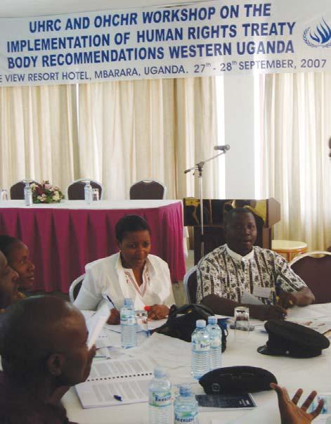 Uganda and the UN Treaty Bodies OHCHR Uganda staff member and a representative from civil society in group work session during a regional workshop on the implementation of concluding observations in