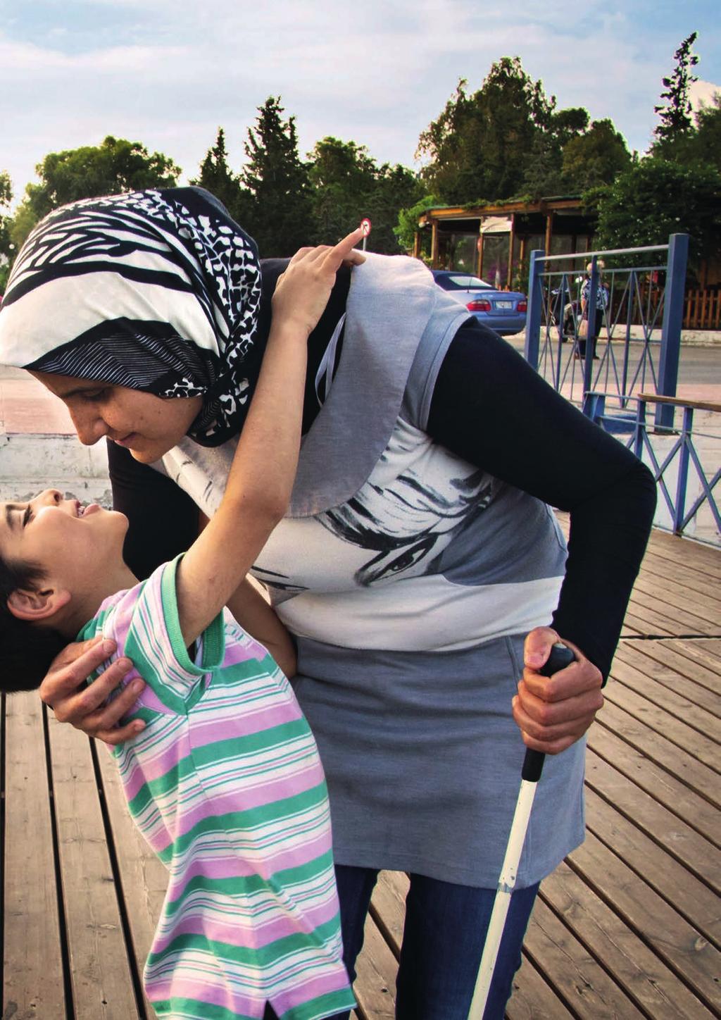 A Syrian refugee embraces her