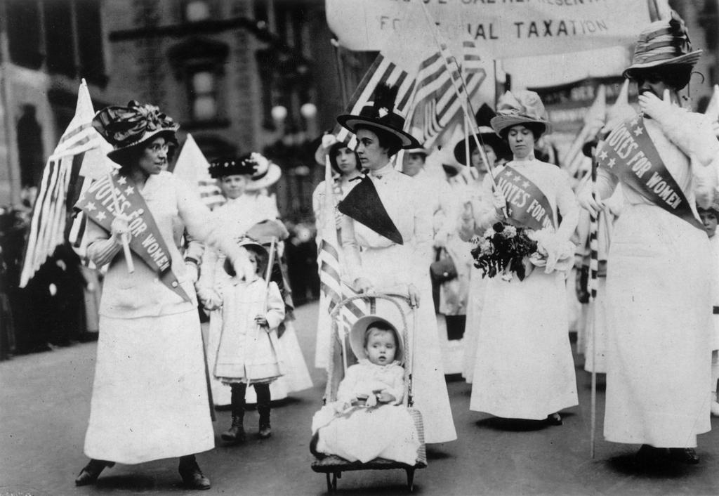 for the first time Some large stores had hung out the yellow suffrage flag and yellow daffodils were being worn by many in the crowd