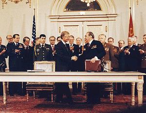 President Carter and Leonid Brezhnev shaking hands after signing SALT II, June 1979 Weapons allowed USA