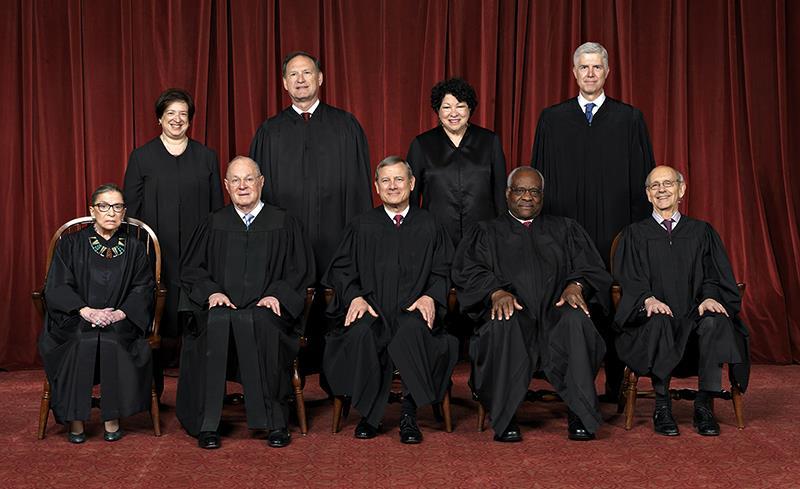 IV. US Supreme Court (VI) Front row, left to right: Associate Justice Ruth Bader Ginsburg, Associate Justice Anthony M. Kennedy, Chief Justice John G. Roberts, Jr.
