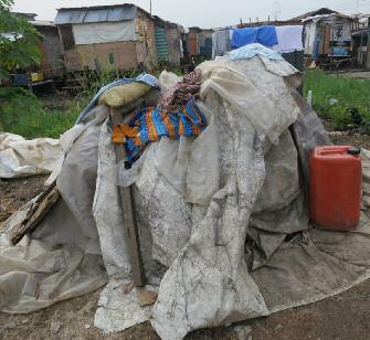 12 Social and Economic Rights Action Centre (SERAC) A makeshift shelter in Badia East, Lagos State, made from materials salvaged from the ruins of hundreds of homes demolished by the Lagos state