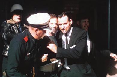 866 Chapter 29 Contesting Futures: America in the 1960s Figure 29.8 Lee Harvey Oswald (center) was arrested at the Texas Theatre in Dallas a few hours after shooting President Kennedy.