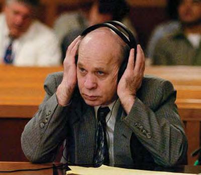 Pretrial Activities and the Criminal Trial CHAPTER 10 341 John Evander Couey (left) using headphones to listen to motions made during jury selection at the start of his 2007 trial in Tavares,