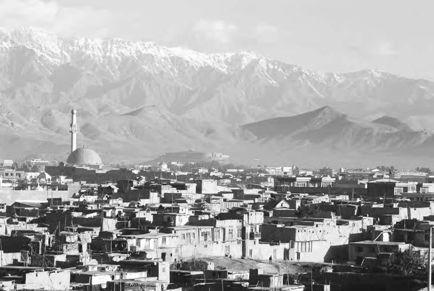 138 KABUL CITY Snow-capped mountains of the Hindu Kush range surround the Afghan capital of Kabul.