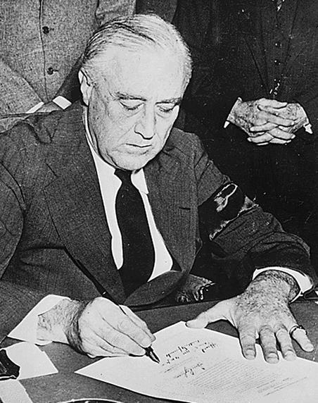 FDR Signs the