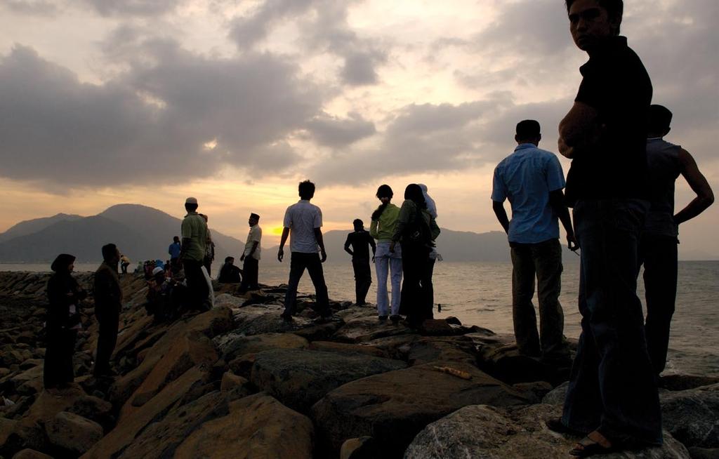 It s customary for Banda Aceh residents to gather every Friday near the entrance to Banda Aceh harbor to watch the sunset.