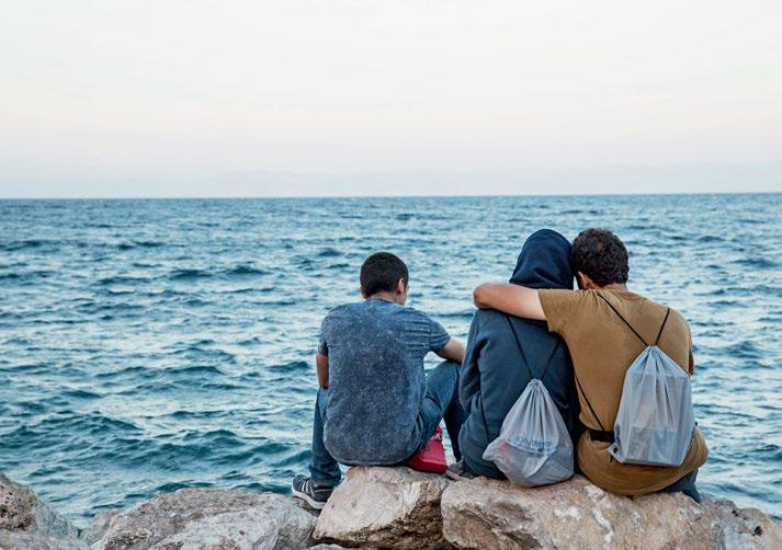 IOM 2016/Amanda Nero Migrants at Lesbos wait for a ship to Athens after a perilous journey in the Mediterranean.