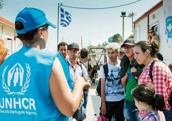 UNHCR/Aikaterini Kitidi UNHCR staff provide procedural and legal information to a group of Syrians in Greece.