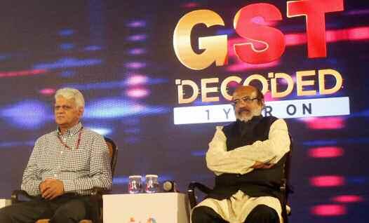 Cabinet Ministers from Kerala and Goa - Thomas Isaac (right) and Mauvin Godinho (left) respectively, during a panel discussion on 'GST Decoded 1 Year On', in New Delhi.