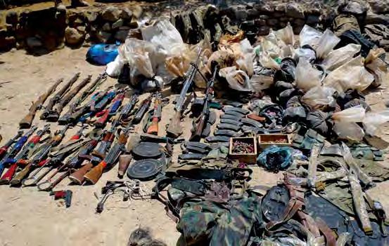 COUNTERNARCOTICS A large cache of weapons and drugs found in Daykundi Province.