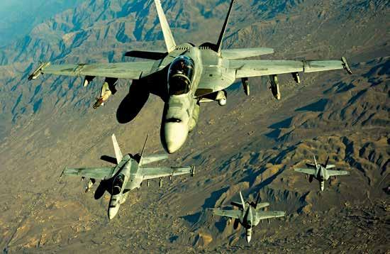SPECIAL INSPECTOR GENERAL FOR AFGHANISTAN RECONSTRUCTION Four U.S. Navy F/A-18 Hornet aircraft fly over mountains in Afghanistan. (U.S. Air Force photo by Staff Sgt. Andy M.