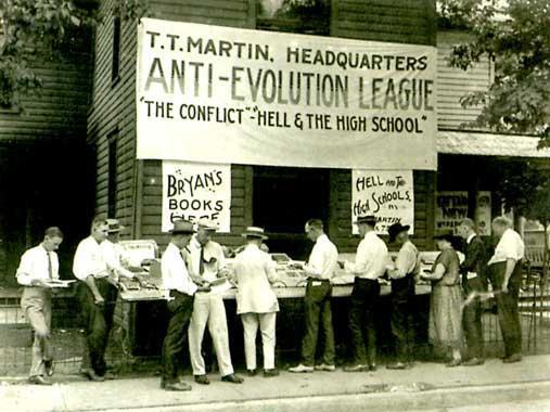 ID- The Battle over Evolution Summary 7- What group is selling books in this picture? Anti-Evolutionists (Creationists) Summary 8- What is the conflict that these men are concerned about?