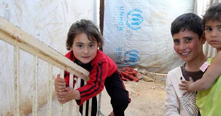 Syrian refugee children play near their temporary home in the Jordanian city of Al Ramtha, near the Syrian border.