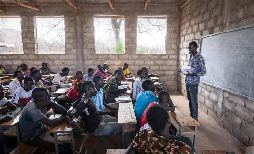 Teacher Lim Bol from South Sudan teaches a class in Ethiopia.