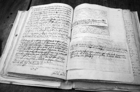 5 Original, hand-written notes from Galileo Galilei regarding his research on sunspots in the early 17th century. Galileo's signature is visible on the left page, at the bottom.