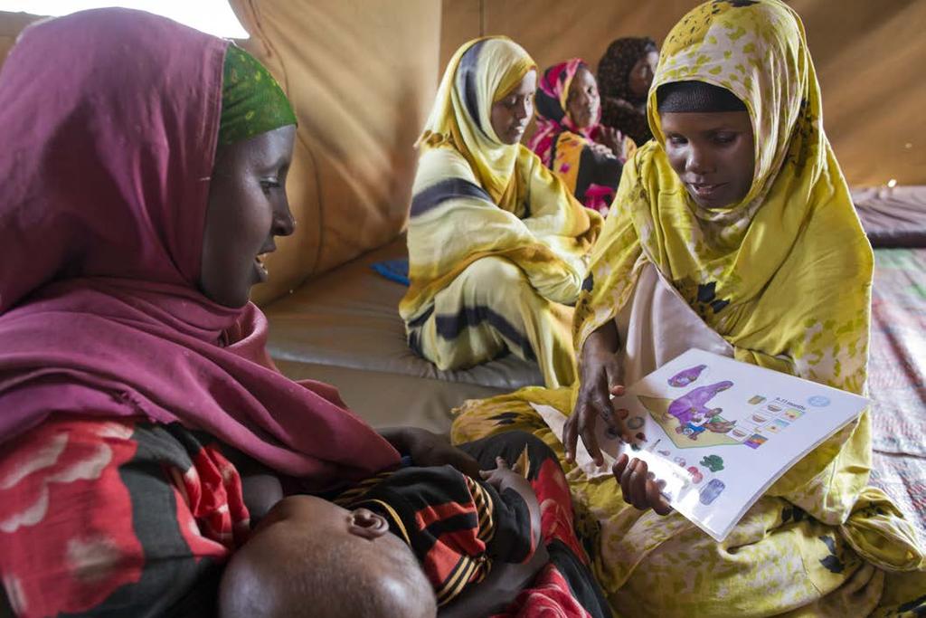 U N H C R / J. O S E Somali mothers learn about infant nutrition at a Baby Friendly Space in Kobe refugee camp.